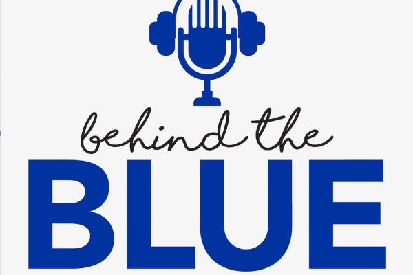 behind the blue microphone logo